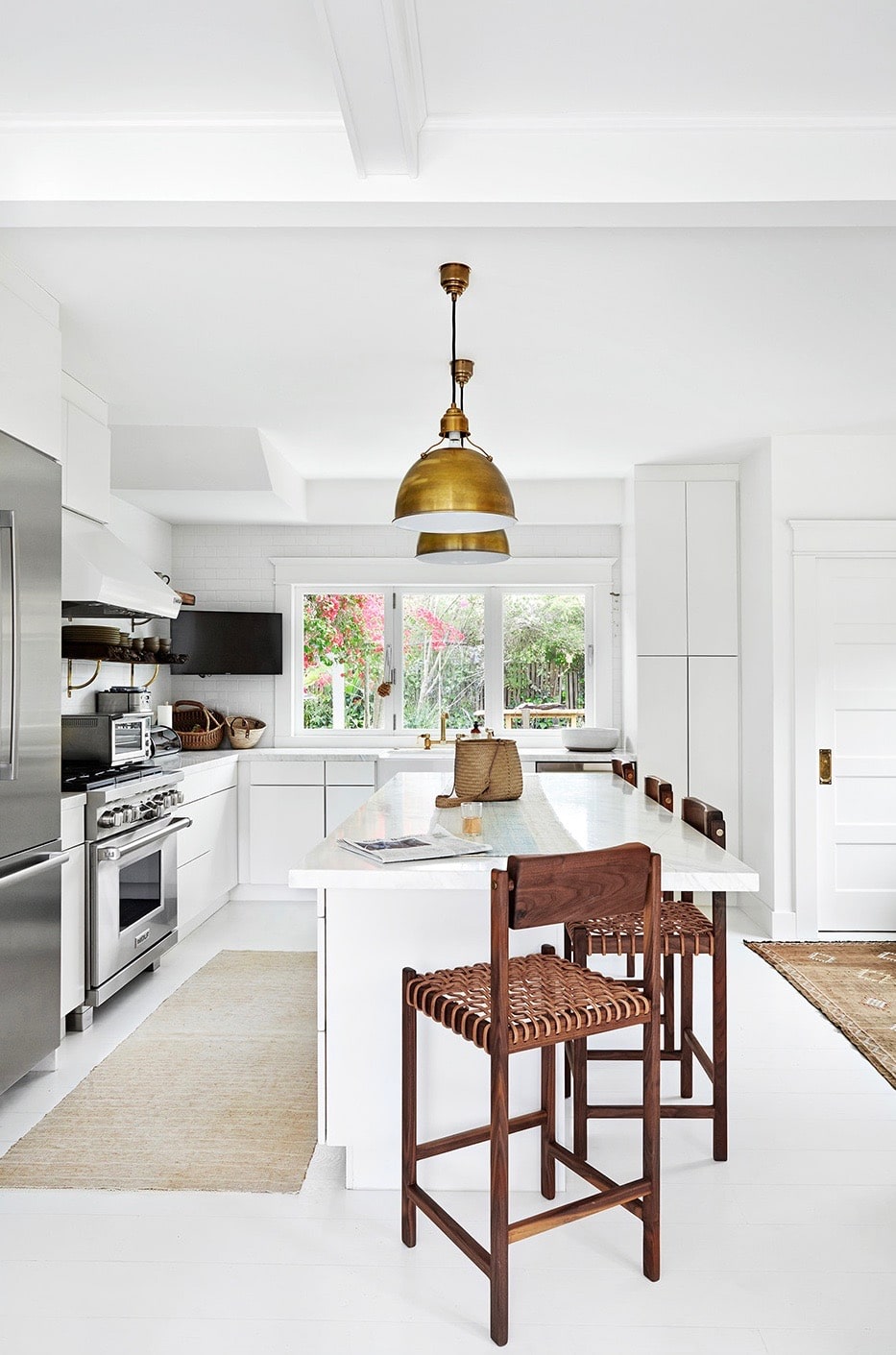 fresh all white kitchen with leather and brass accents | california house tour on coco kelley