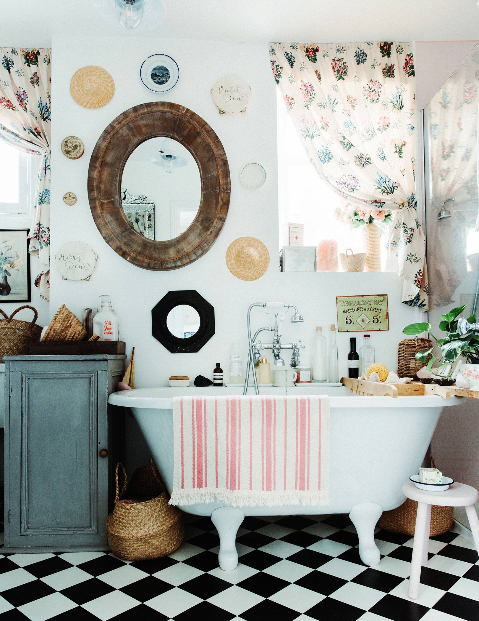 funky eclectic clawfoot bath with checkerd floors
