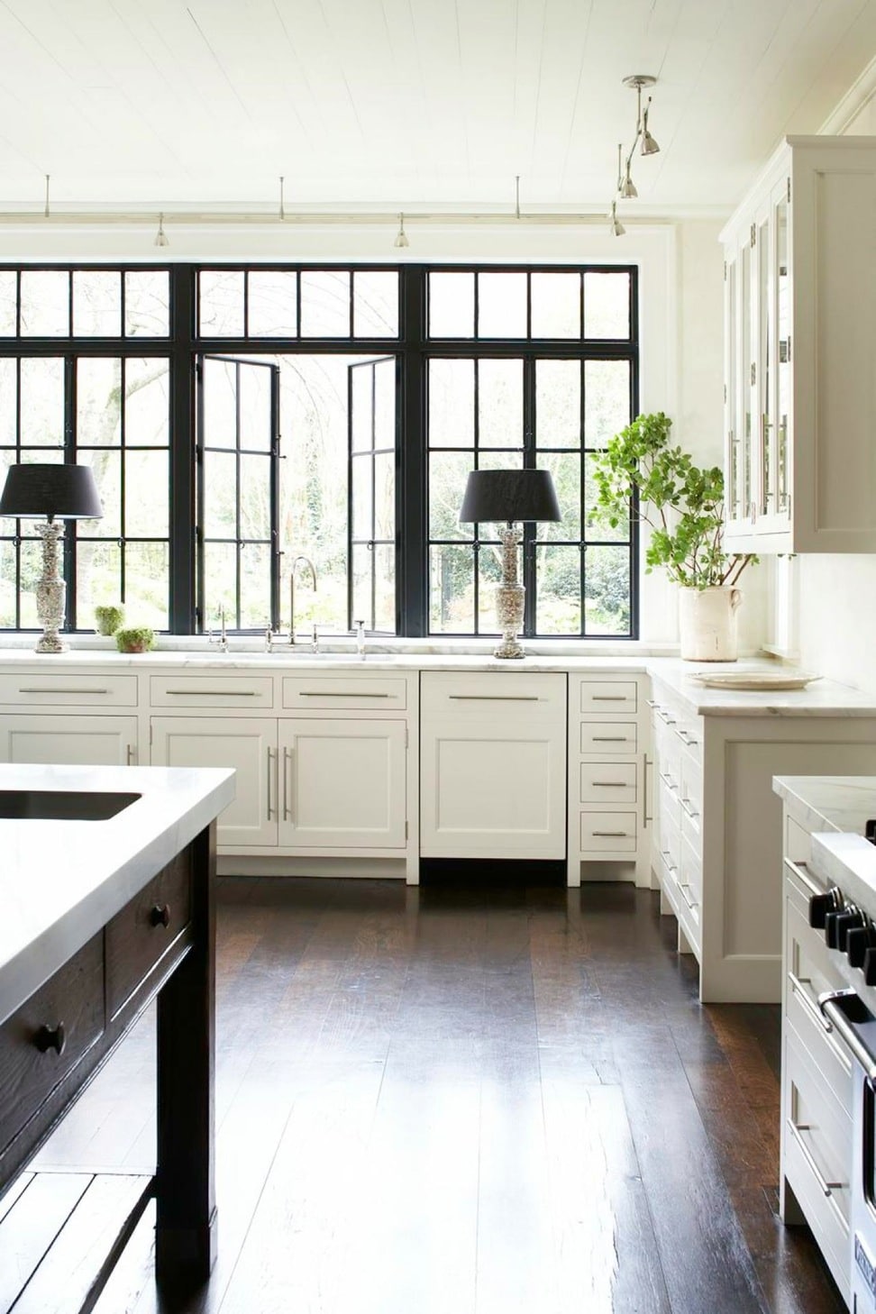 gorgeous black and white kitchen with stunning windows | via coco kelley