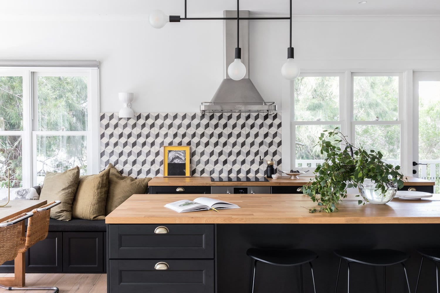 graphic black and white tile backsplash in a modern kitchen | house tour on coco kelley