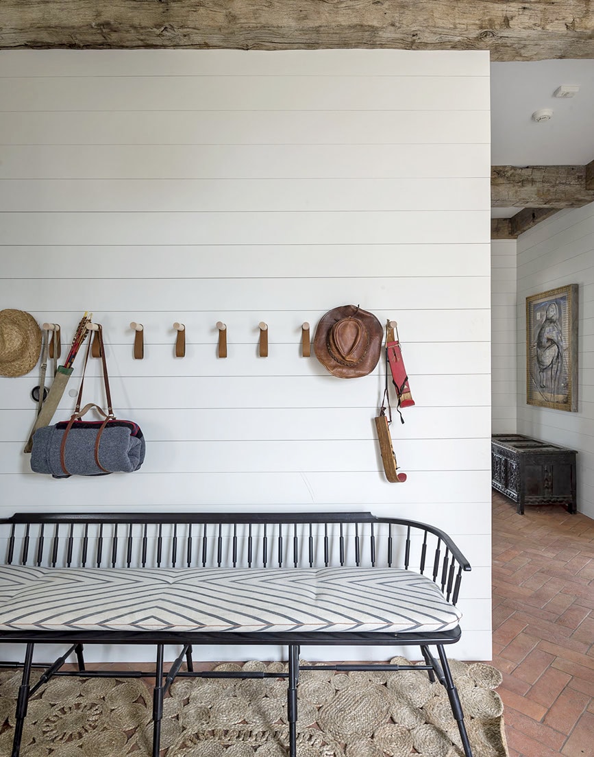 hooks and bench in the entryway | full house tour on coco kelley