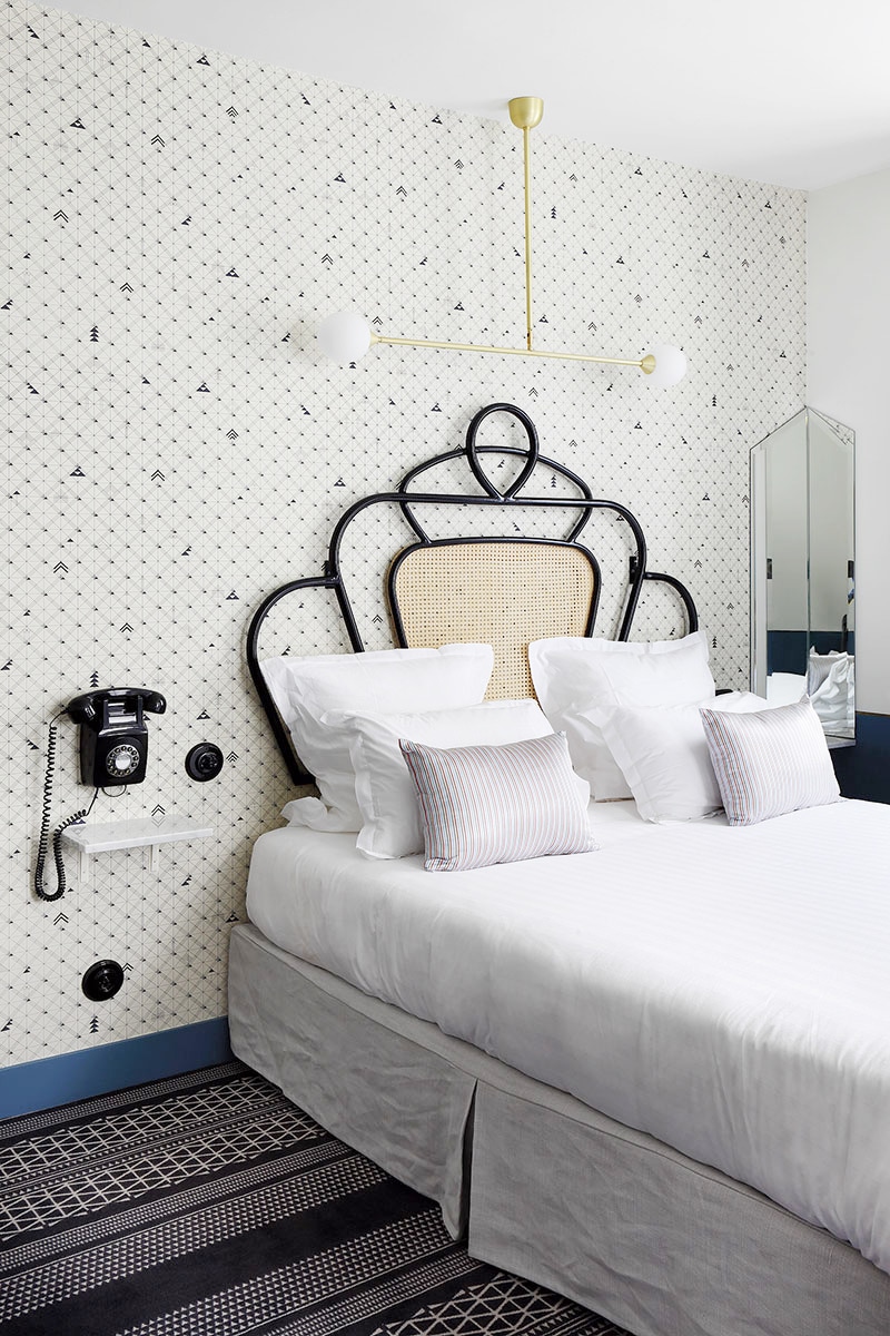 hotel panache cane bed and wallpaper paris | statement headboard roundup on coco kelley