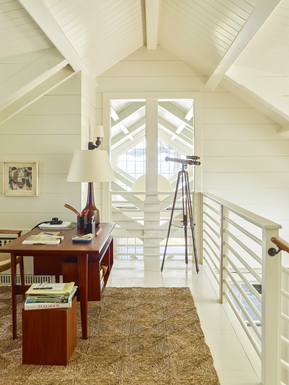 an open lofted office space in a cottage style home by the sea | design by gil schafer on coco kelley