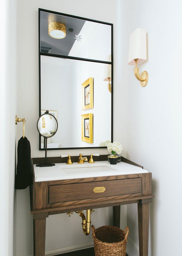 a modern neutral powder room by kate marker with wood black and white and brass | via coco kelley