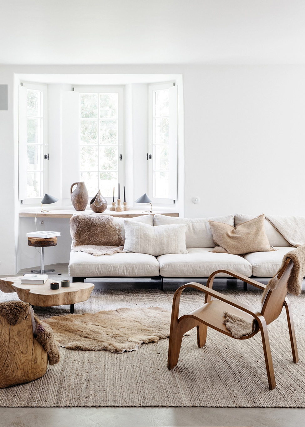 layered furs and whites in this cozy living room