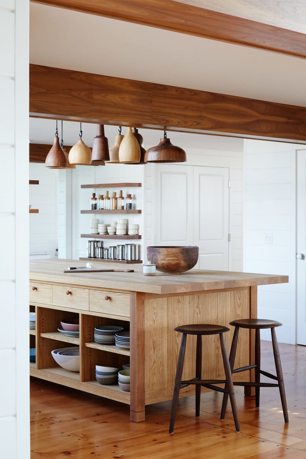 layered wood tones kitchen island | modern shaker beach house tour on coco kelley