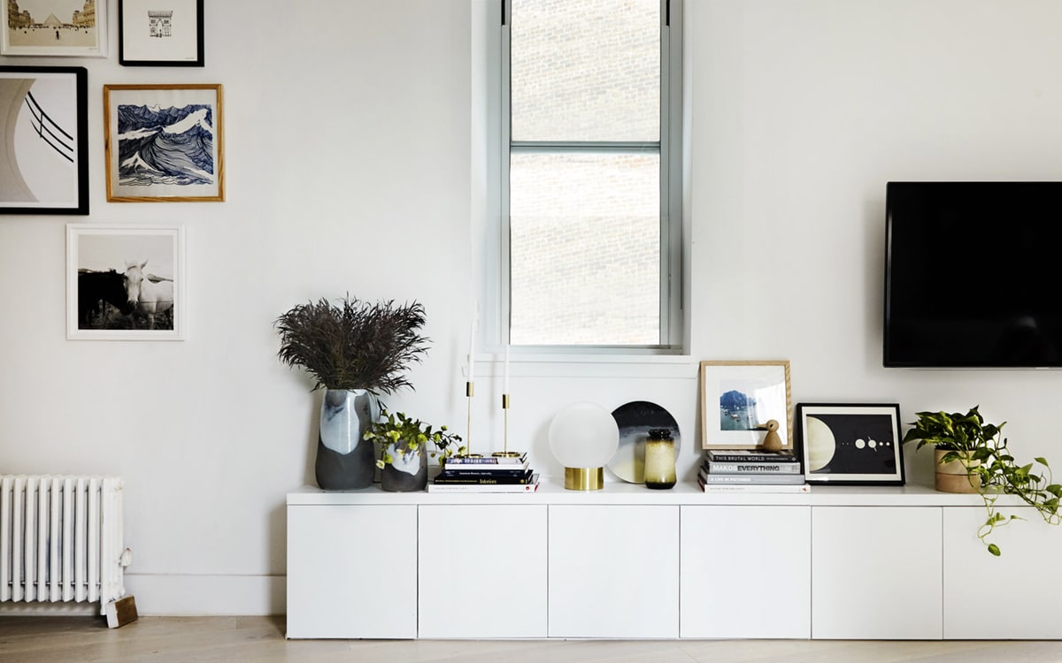 long low console cabinet with art wall and tv | coco kelley