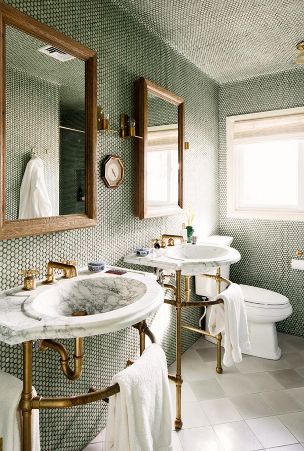 beautiful bathroom with floor to ceiling penny tile, brass hardware and marble sinks | via coco+kelley