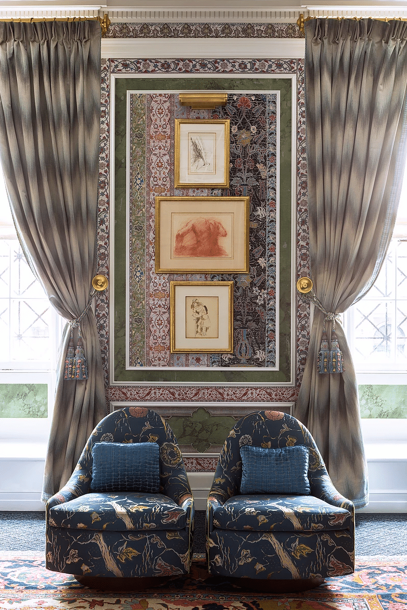 maximalist living room featuring layers of wild pattern and animal print with a blue velvet sofa | coco kelley room of the week