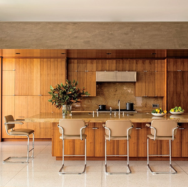 a mid-century modern style kitchen with wood and terrazzo | via coco kelley