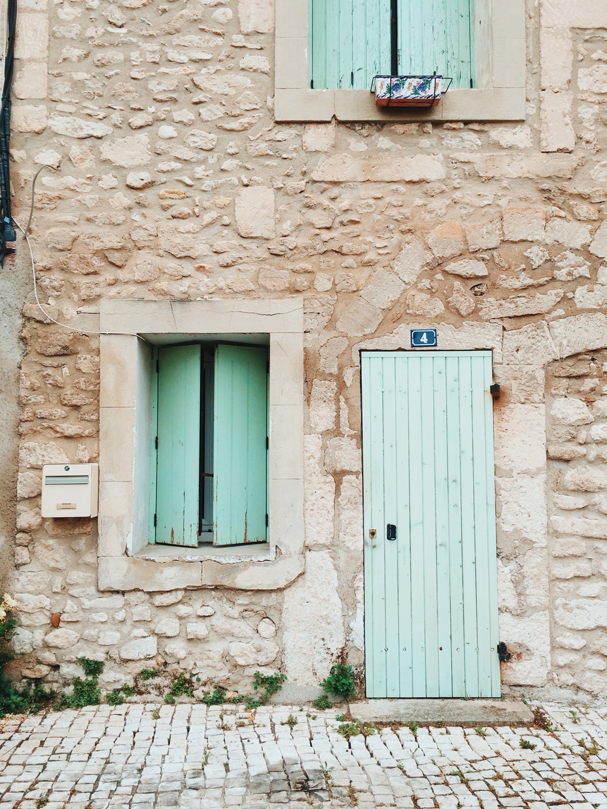 mint green windows and doors in saint remy provence (france) | 24 hour travel guide from coco kelley