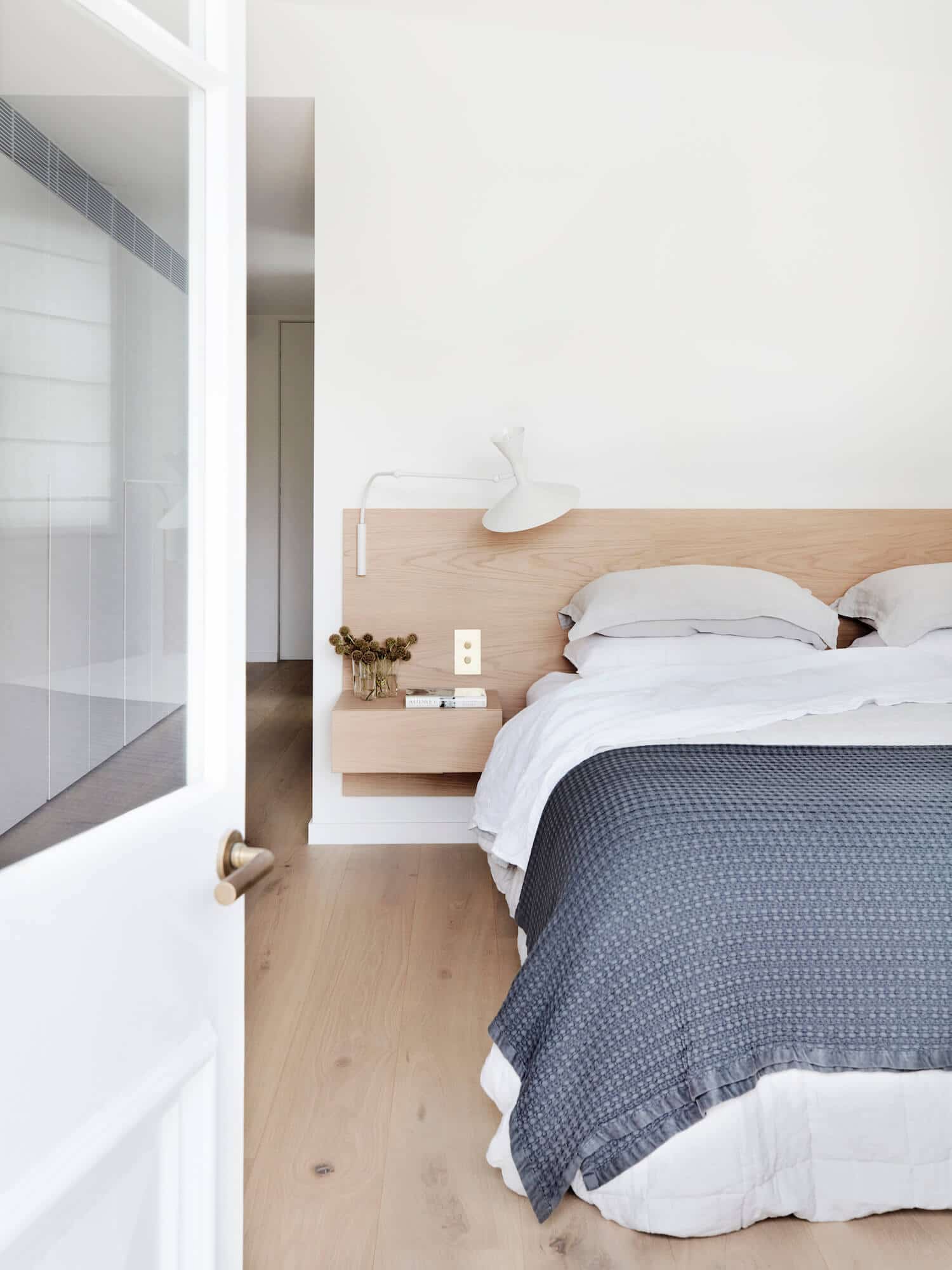 modern bedroom with floating oak headboard | house tour on coco kelley