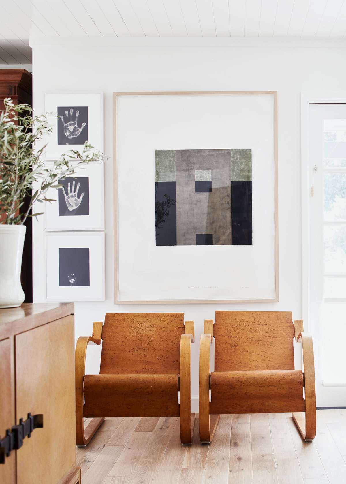 modern chairs pair with a gallery wall | relaxed ranch house tour on coco kelley