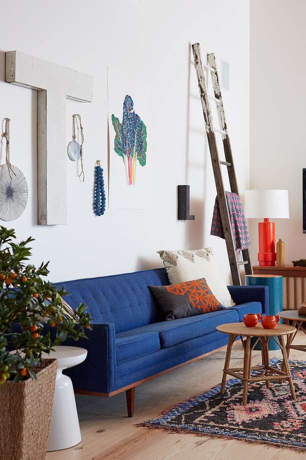 modern farmhouse in sonoma with blue midcentury sofa and eclectic art wall | via coco kelley