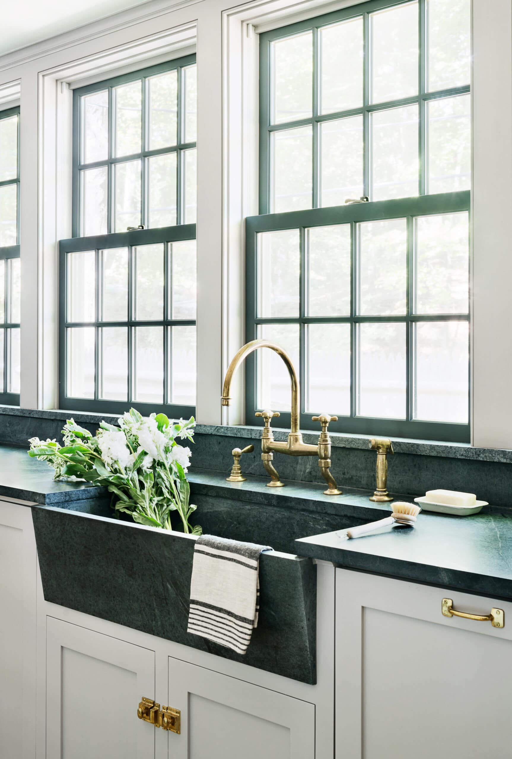 modern green marble apron sink with classic brass hardware and gorgeous kitchen windows | coco kelley