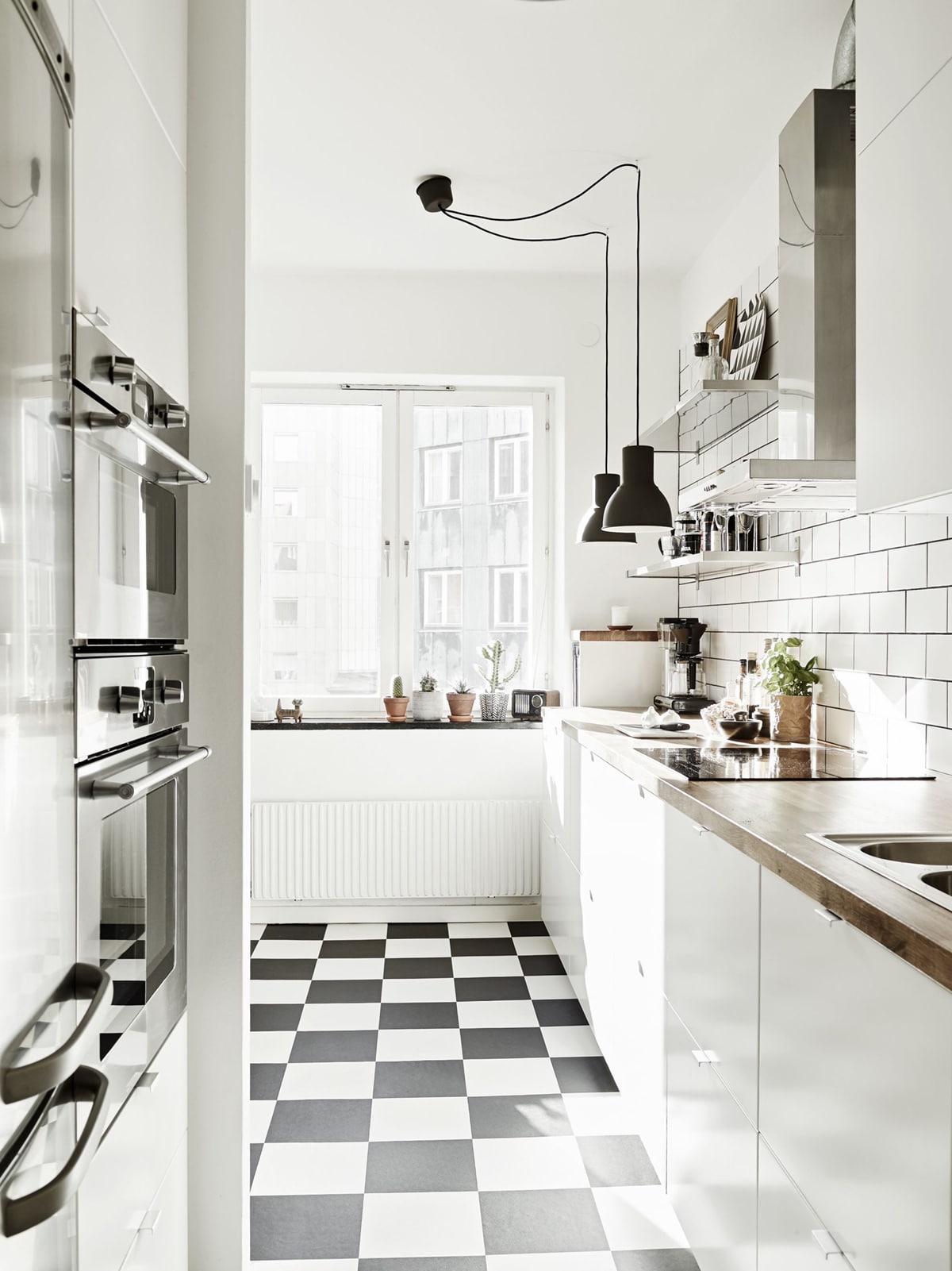modern scandinavian black and white kitchen with checkered floors