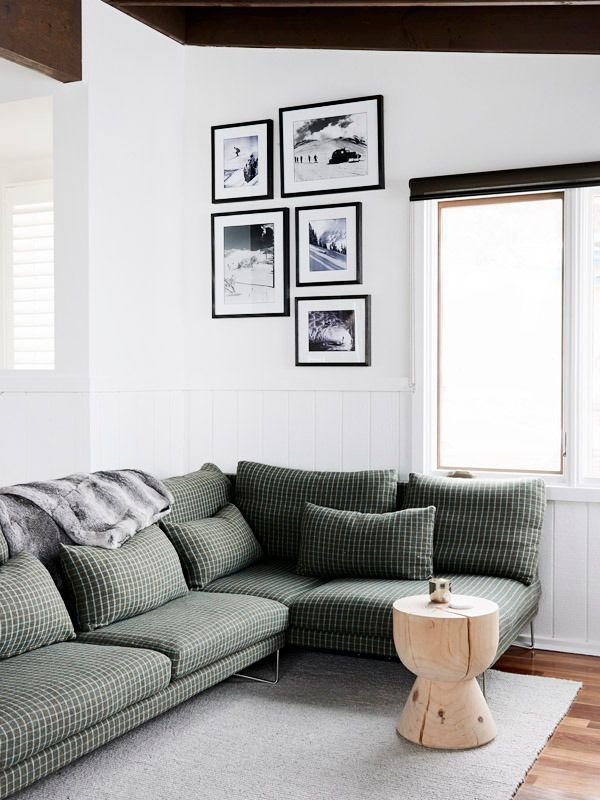 modern sofa with menswear/plaid fabric in all white room
