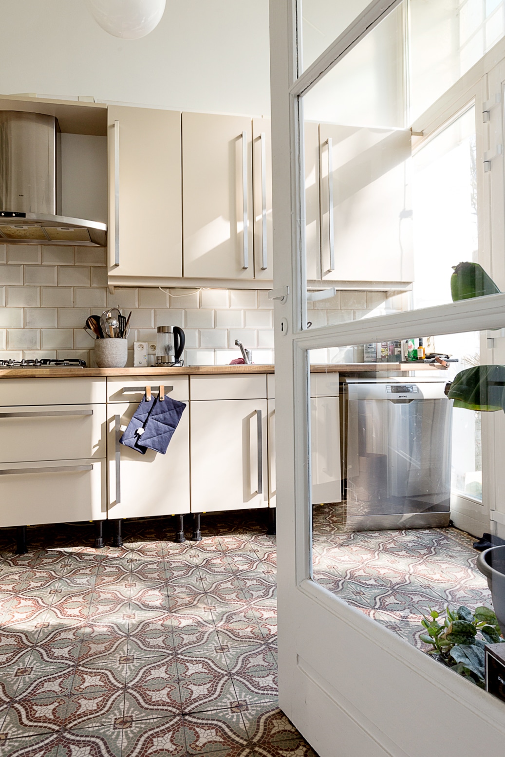 cream kitchen with gorgeous tile floors | bohemian house tour on coco kelley