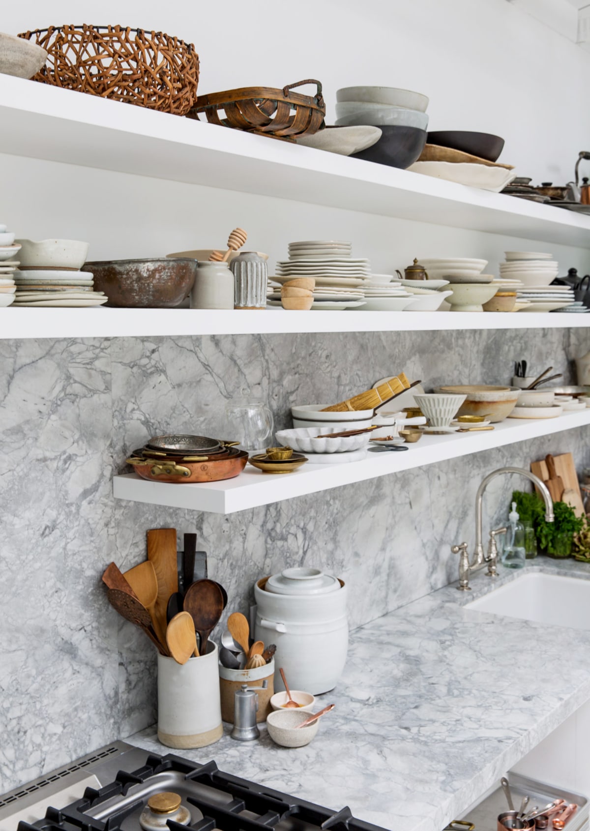 open shelving holds tons of food styling props | backyard photo studio kitchen tour on coco kelley