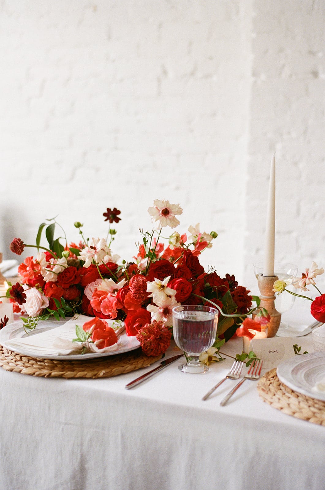 red and pink floral for valentines day tabletop by anthera floral
