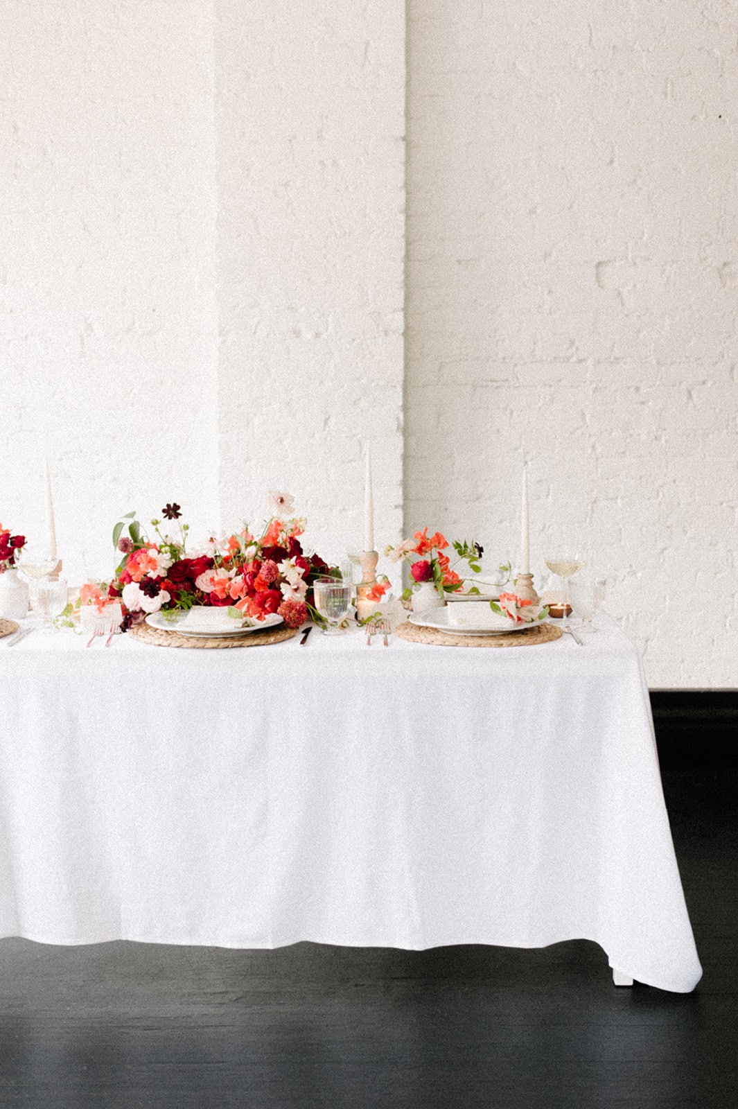 red and pink floral for valentines day tabletop by anthera floral