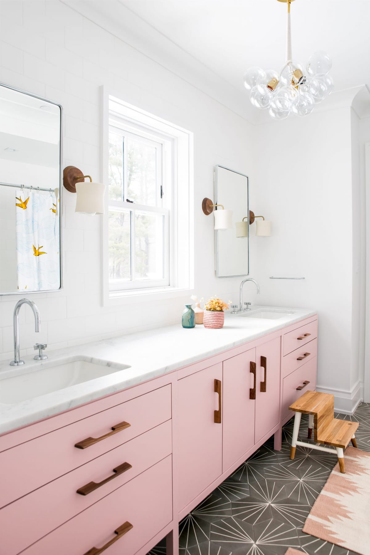 pink bathroom cabinets and fun tile for a kids double sink bathroom | house tour on coco kelley