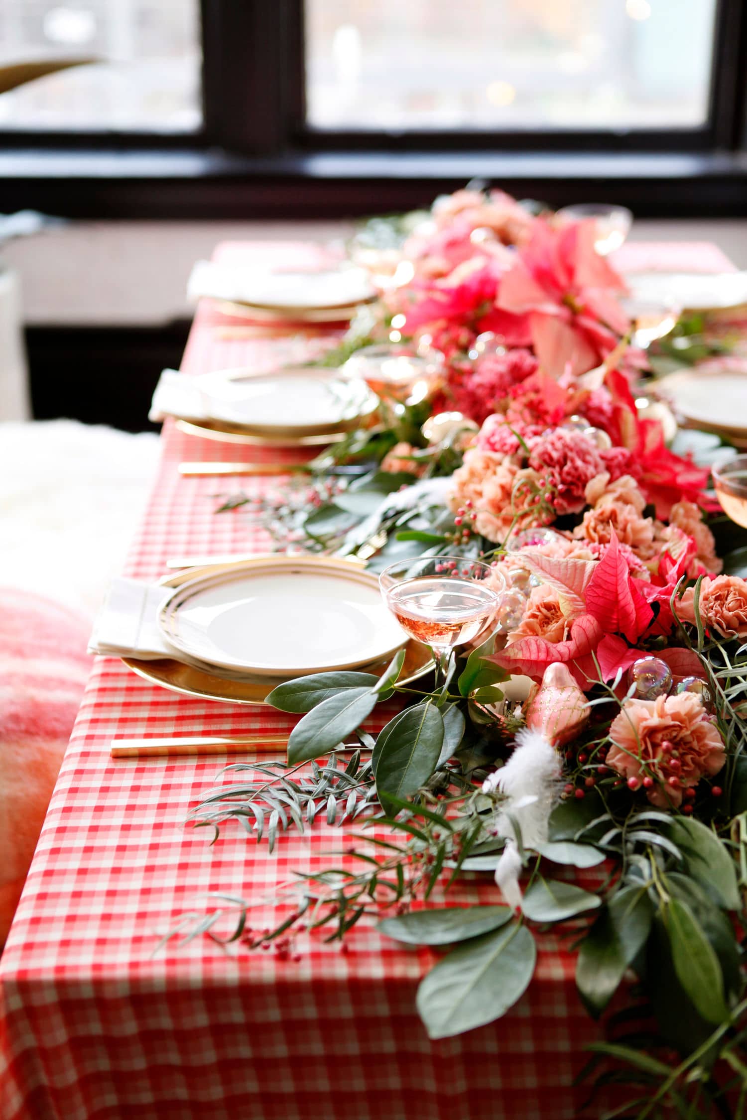 pink and red plaid and poinsettia christmas tabletop with floral runner by coco kelley