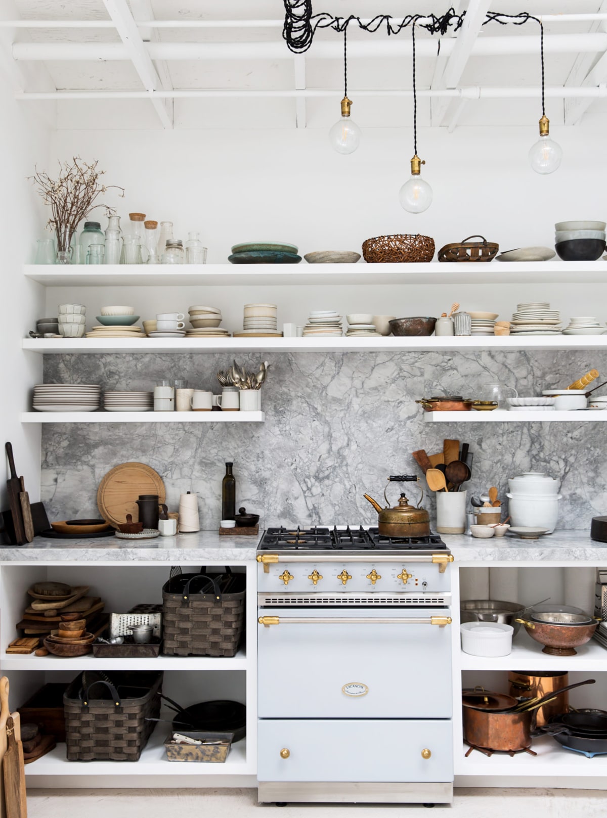shelves full of props in this backyard photo studio | tour on coco kelley