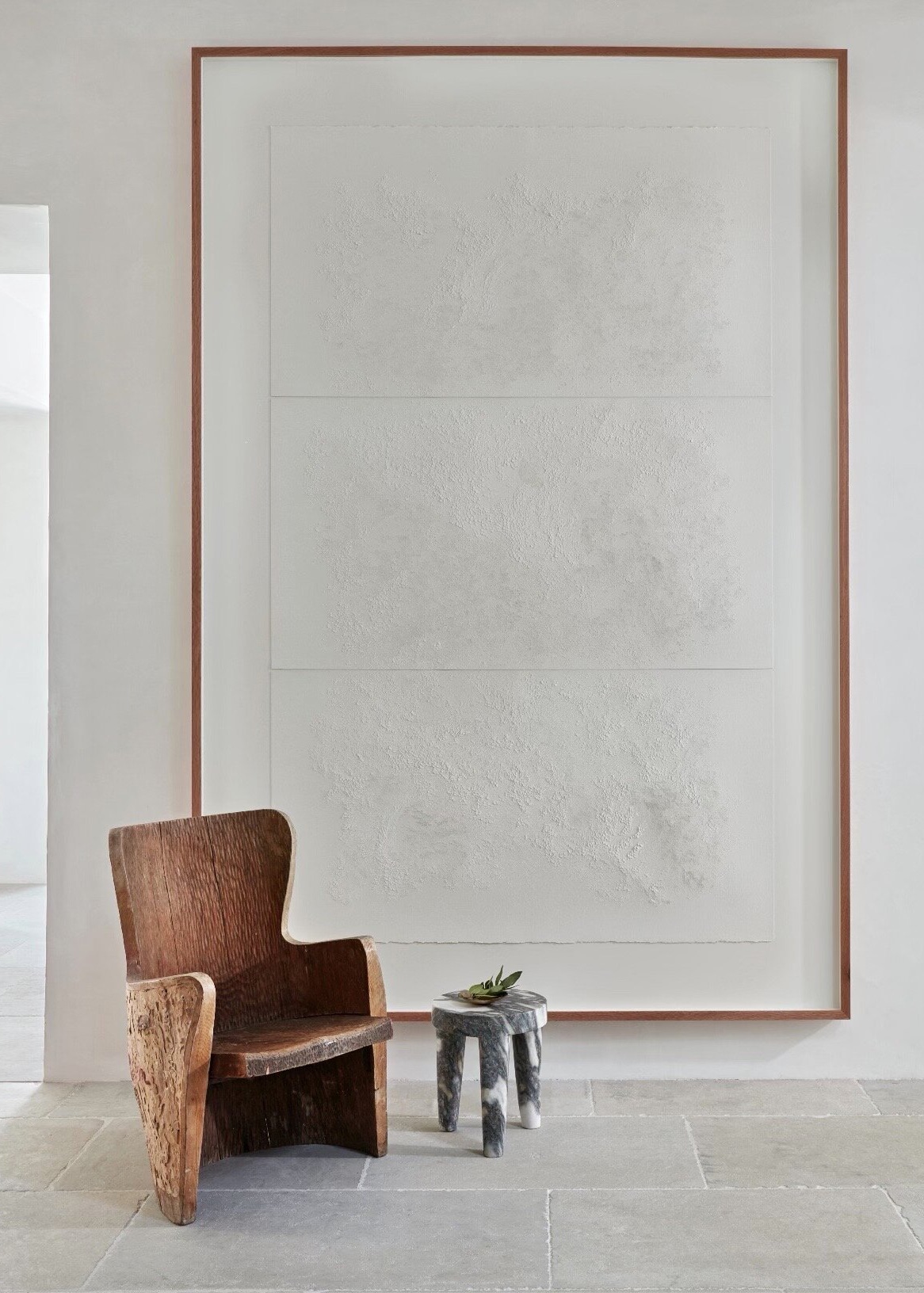 large scale art and sculptural chair and table by jill egan interiors