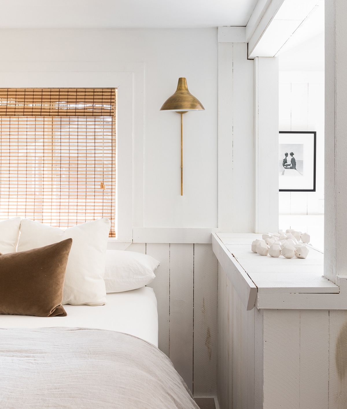 simple cottage bedroom with luxe details and a peek a boo window | cannon beach cottage design by maison luxe on coco kelley