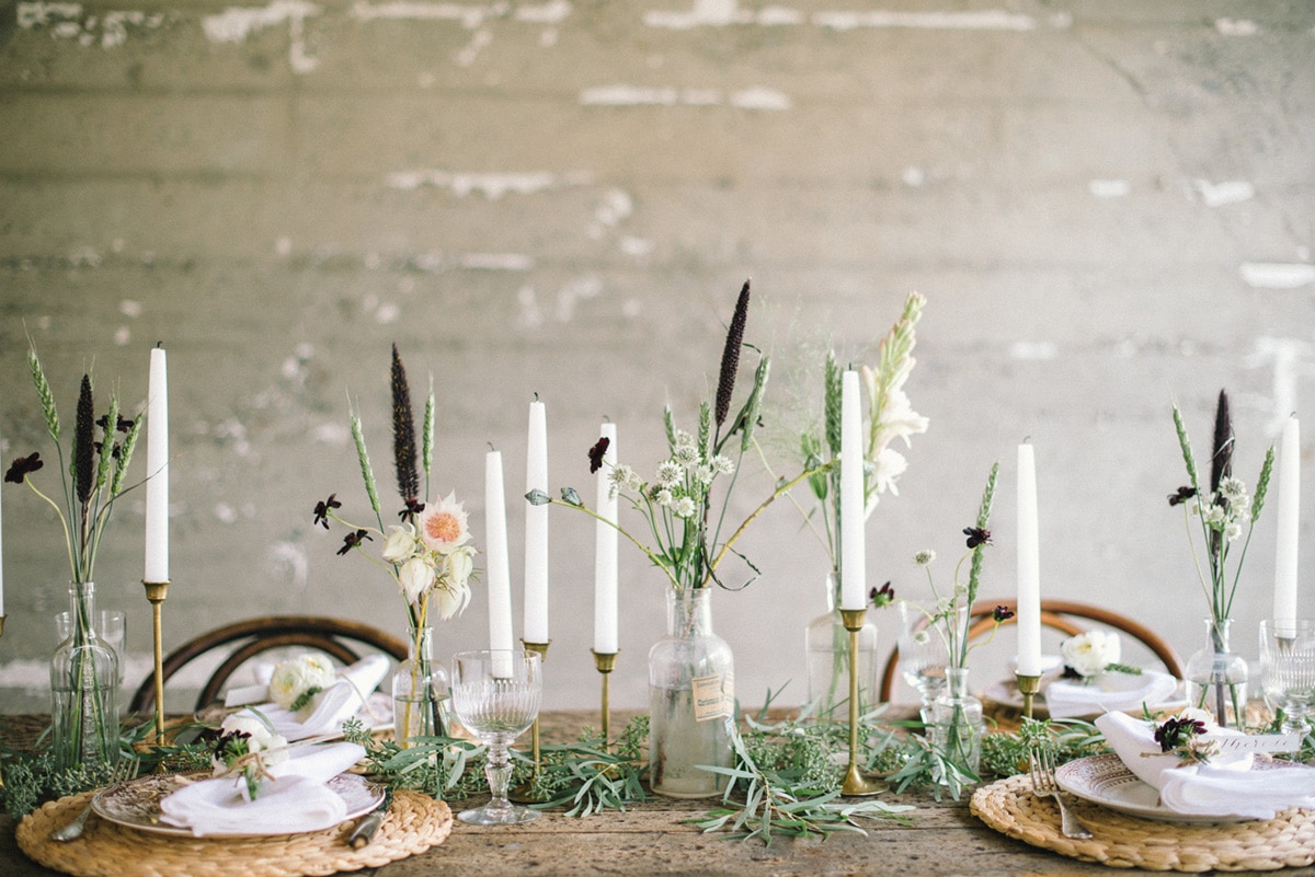 simple floral stems and candlesticks for this industrial meets nature tabletop | inspiring thanksgiving tabletops on coco kelley