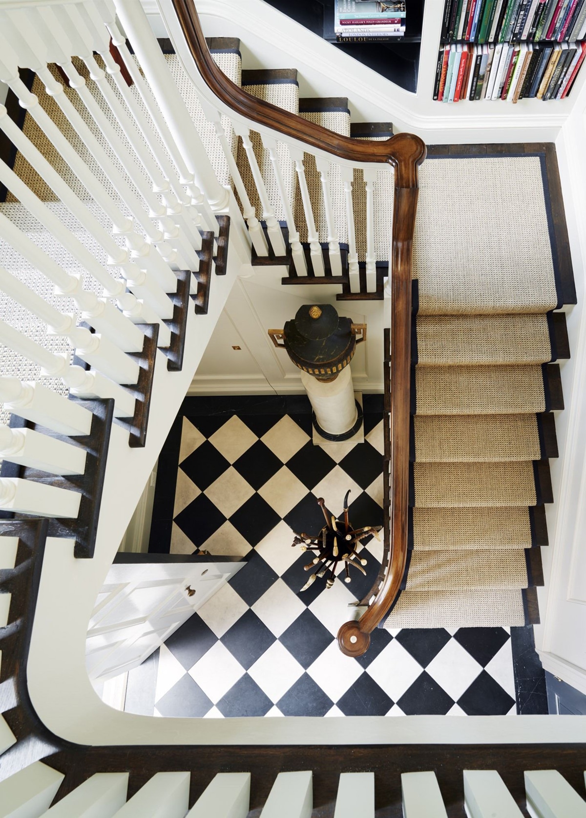 staircase with black and white checkered floor landing | coco kelley