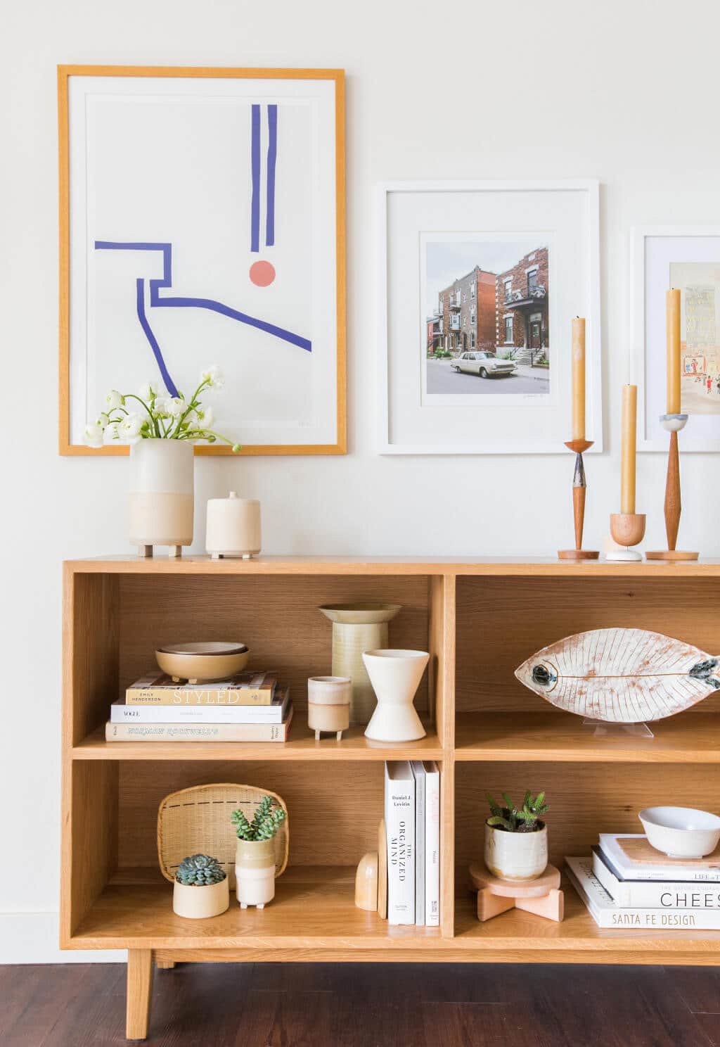 styled shelves with warm wood accessories - design by emily henderson | coco kelley