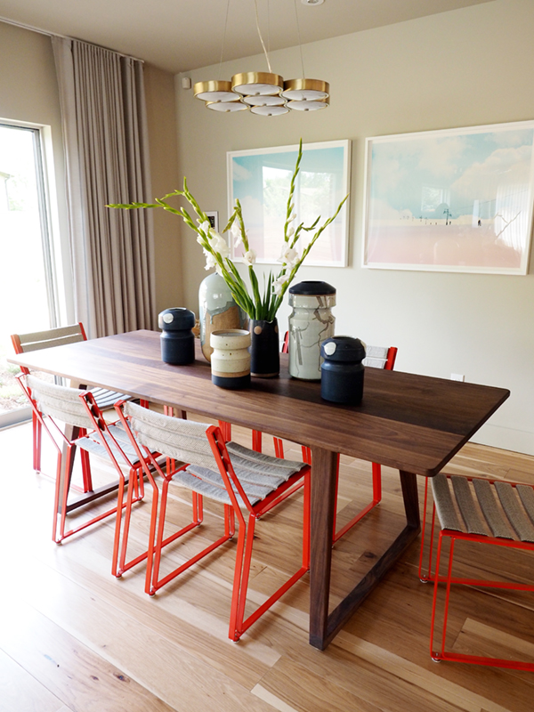 sunset idea house tour - dining room with red chairs | via coco+kelley