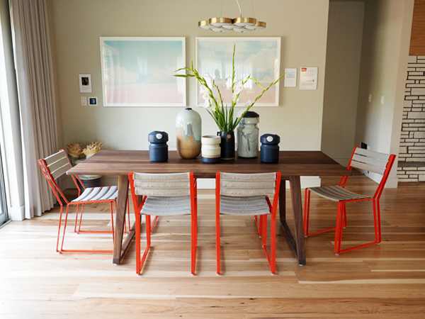 sunset idea house tour - dining room with red chairs | via coco+kelley