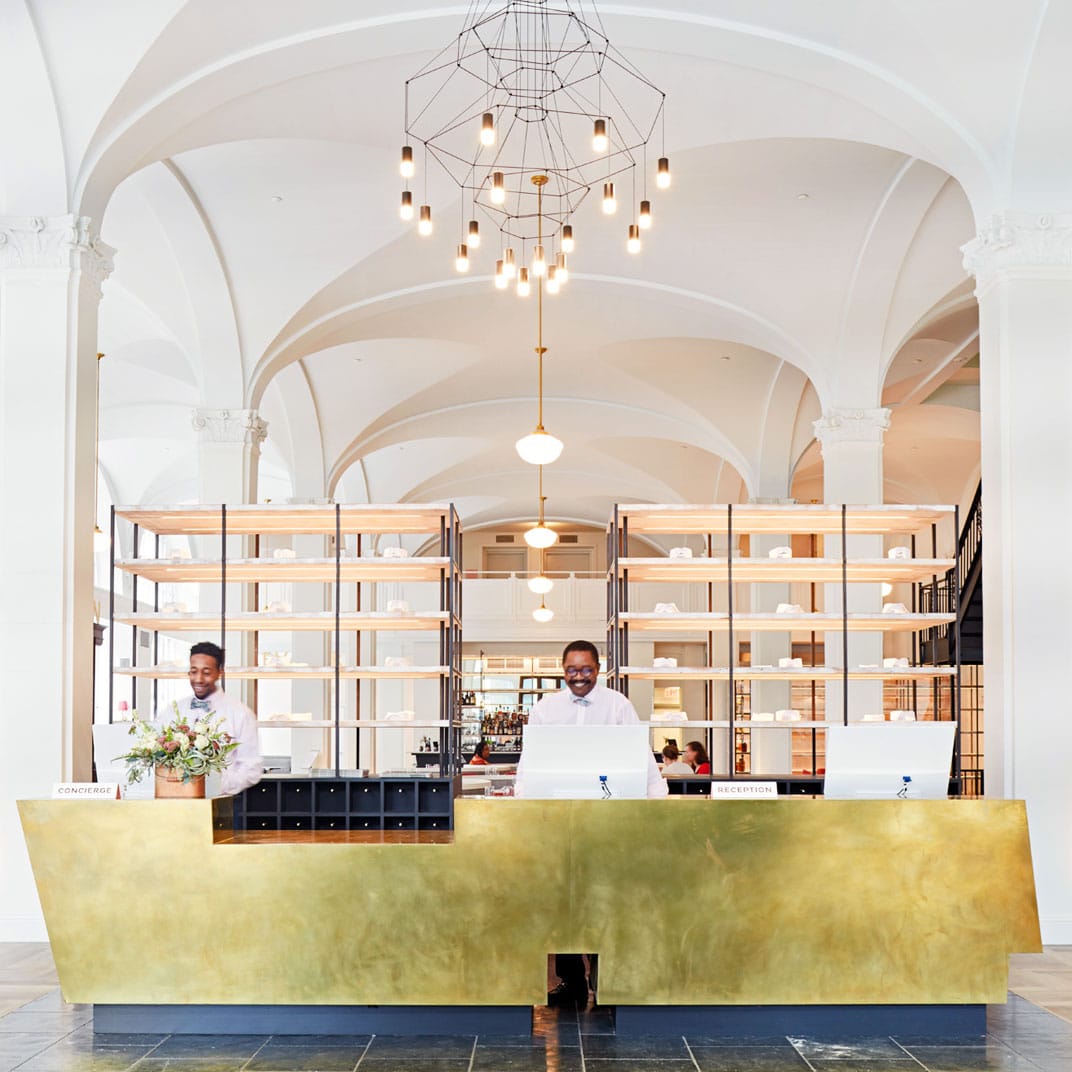 the gold reception desk at the Quirk Hotel | wanderlust design via coco kelley