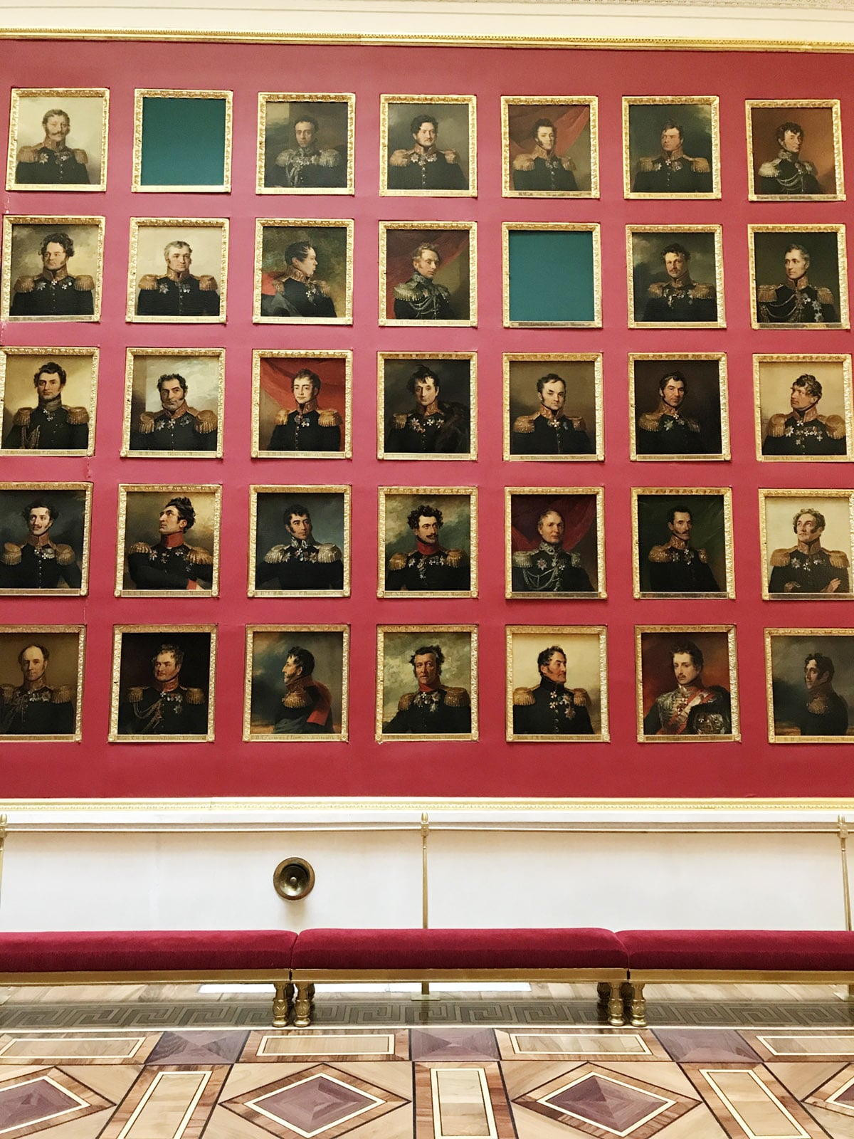 a wall of portraits at the Hermitage Museum in St. Petersburg | travel guide on coco kelley