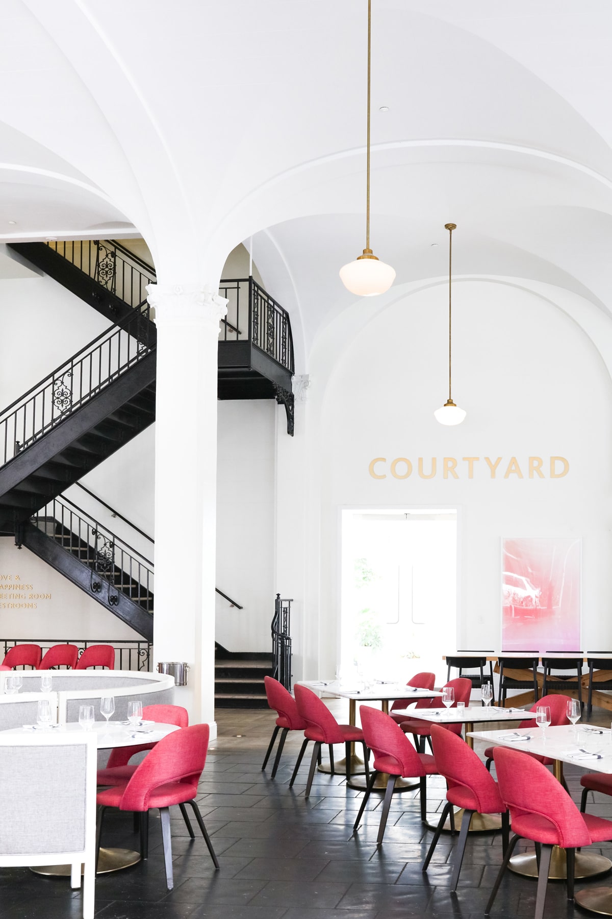the interior of the quirk hotel richmond with white arched ceilings and historical architecture | wanderlust design tour on coco kelley