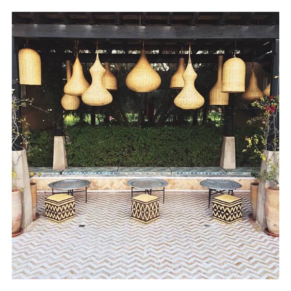 the patio at peacock pavilions marrakech woven lanterns and beautiful tile