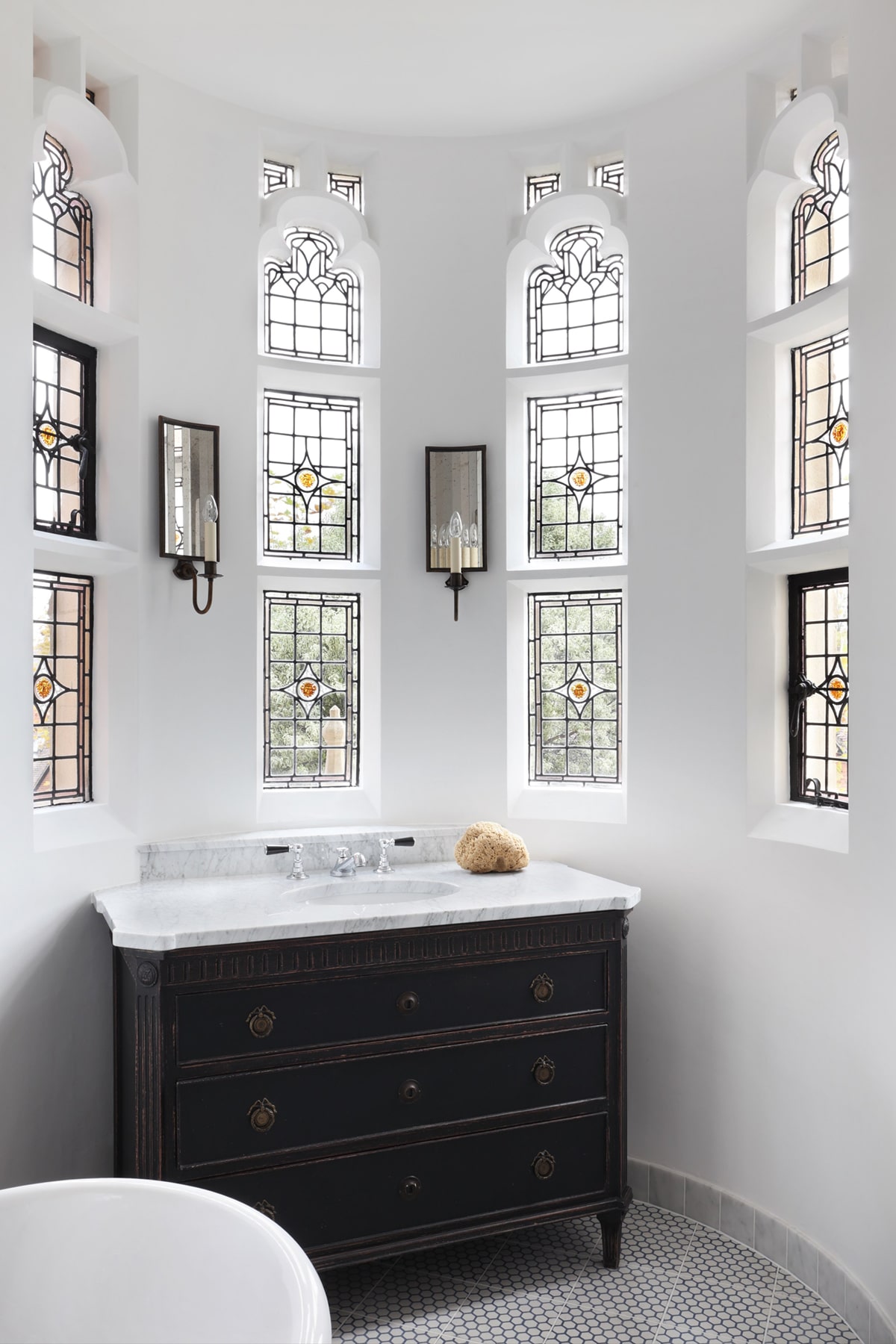 townhouse bathroom with gorgeous stained glass windows by HAM interiors