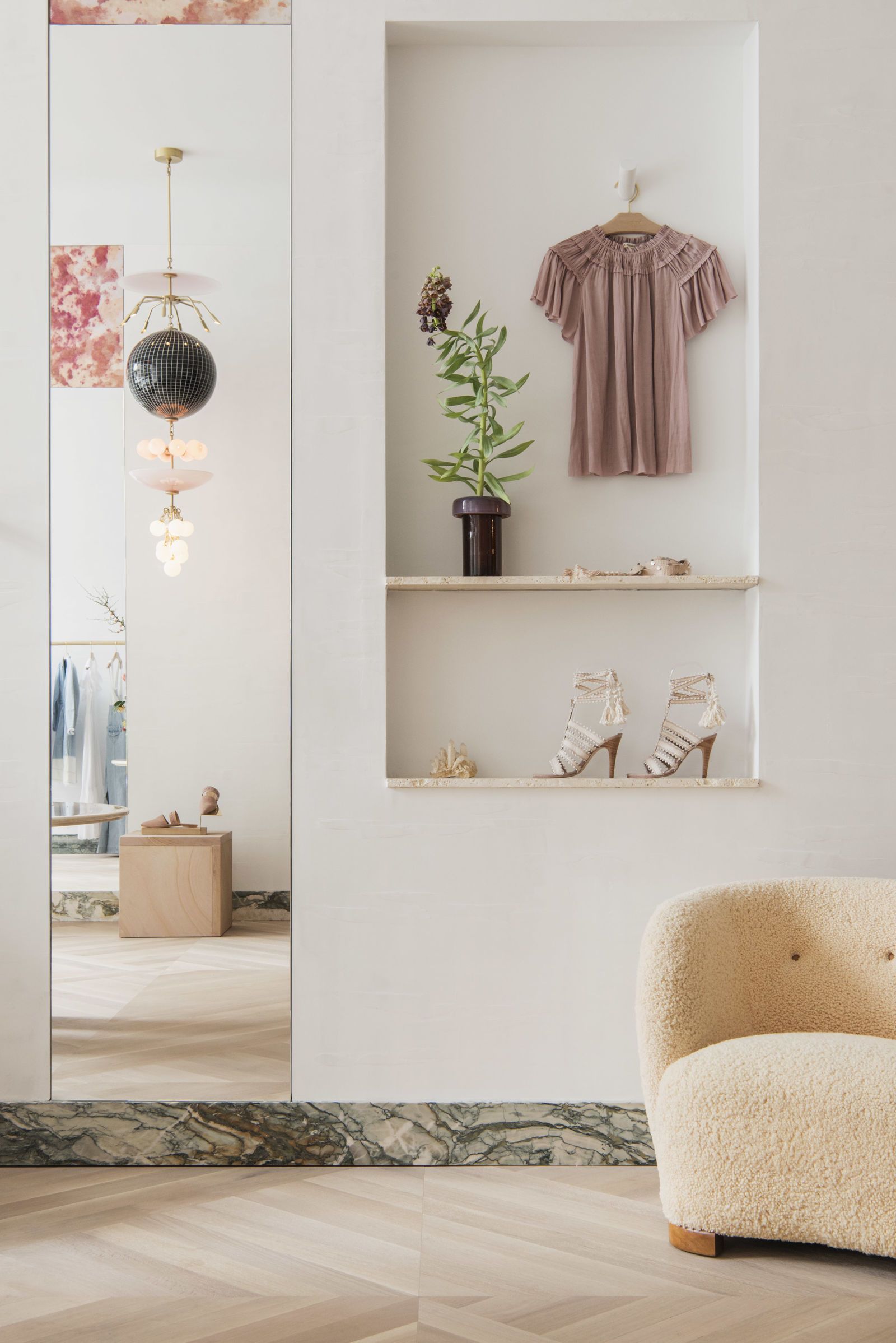 ulla johnson store with gorgeous herringbone floors and a fuzzy shearling chair | coco kelley