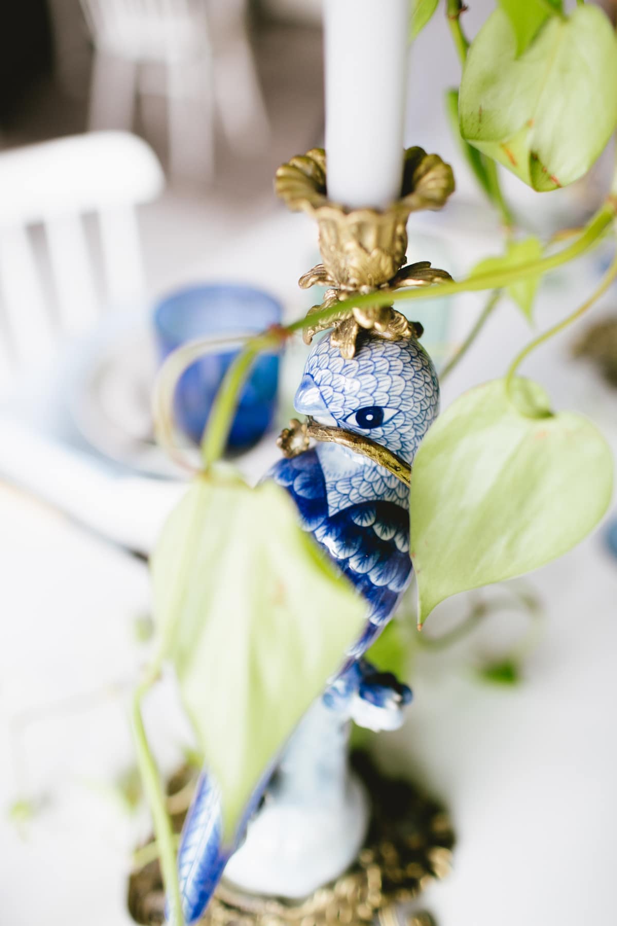 vintage blue and white porcelain bird candlesticks on an eclectic tabletop | coco kelley