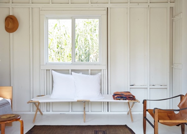 whitewashed beach cabin with minimal decor | house tour via coco kelley